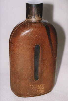 antique leather cased glass bottle> </TD>
<TD align=